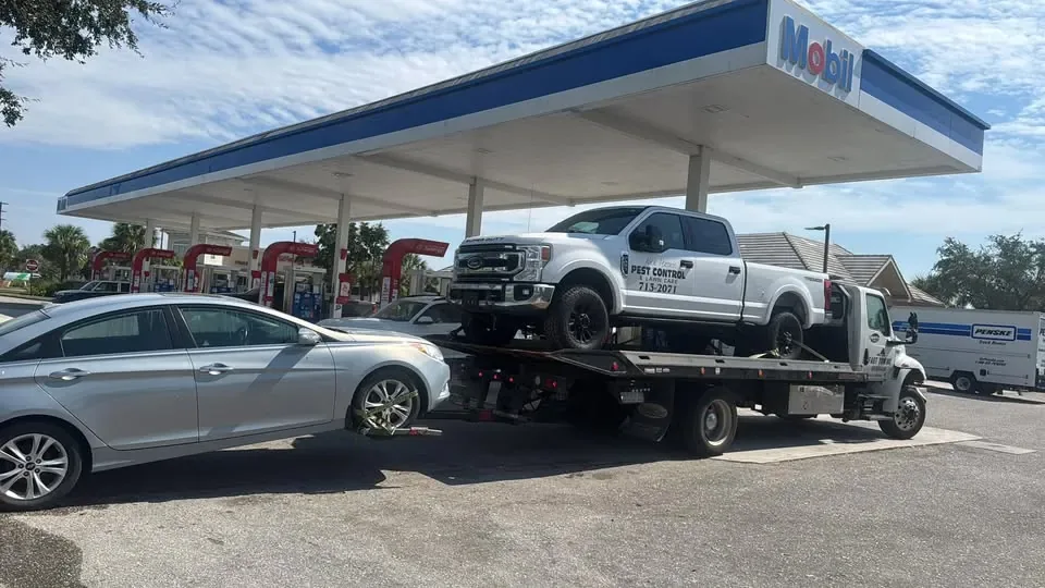 Ford F-250 pickup loaded on the DMV Tow Trucks flatbed